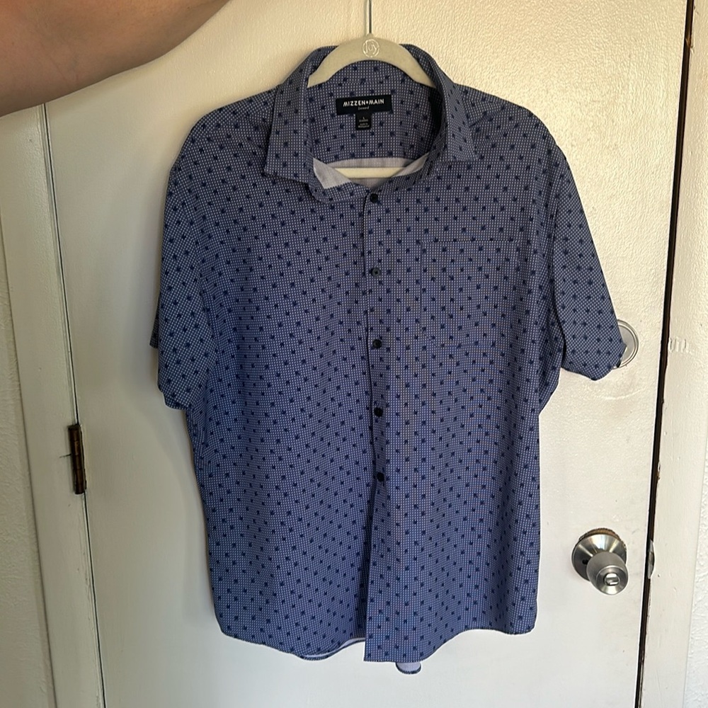 Blue short sleeve button up with dotted pattern.